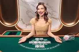 Live blackjack game interface with chip selector and player hand display
